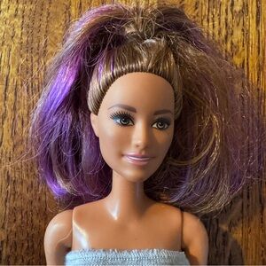 Barbie with purple highlights and a 2015 marking